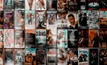 A wall covered in vintage VHS tape covers