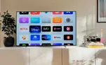 A TV home screen showing Netflix, Disney+, and other streaming apps